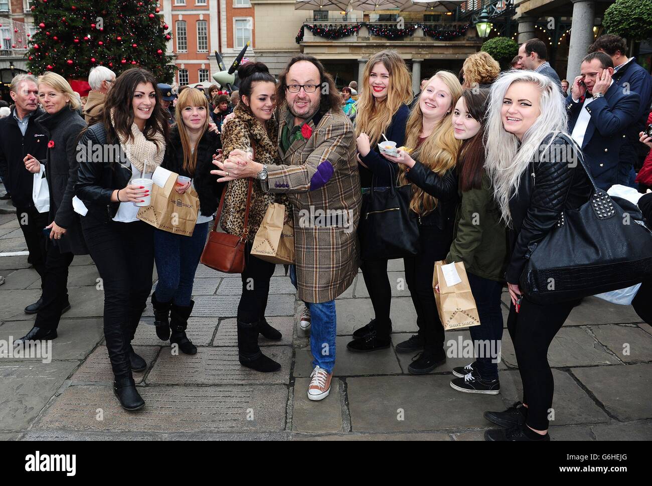 Strictly contestants selling poppies in London. Dave Myers poses with fans as he sells poppies in Covent Garden, London. Stock Photo