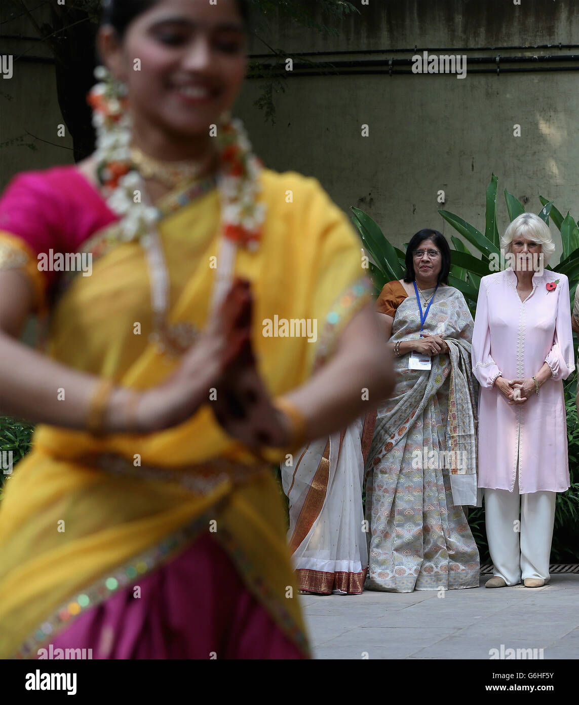 The Duchess of Cornwall watches dancers at Asha Sadan (House of Hope) for children who have been abandoned or abused, in Mumbai, on the fourth day of their official visit to India and Sri Lanka. PRESS ASSOCIATION Photo. Picture date: Saturday November 9, 2013. See PA story ROYAL Tour. Photo credit should read: Chris Jackson/PA Wire Stock Photo