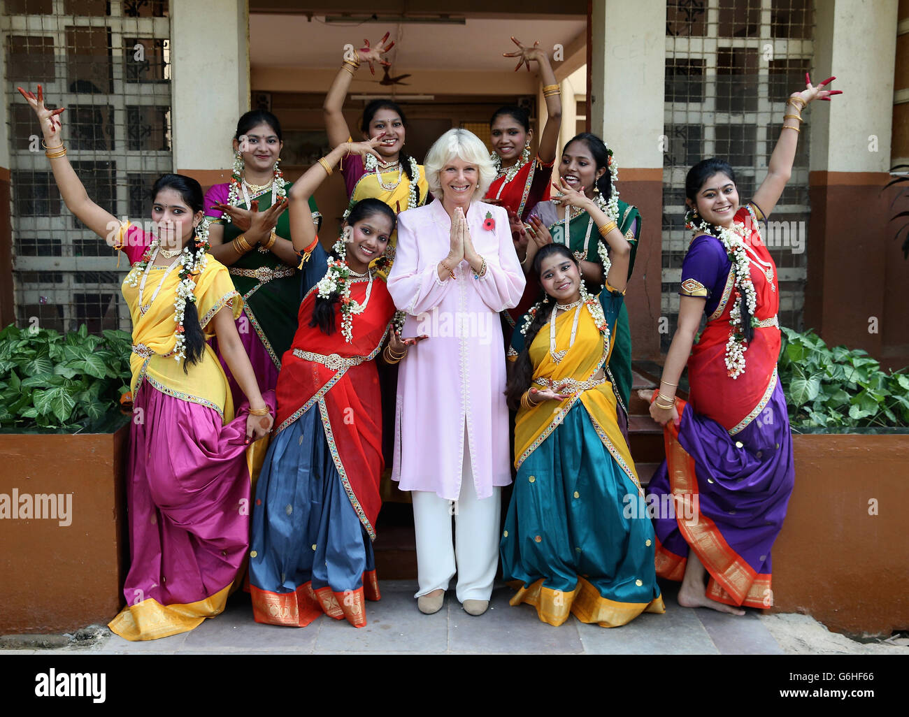 The Duchess of Cornwall is shown some Indian dance moves by girls from Asha Sadan (House of Hope) for children who have been abandoned or abused, in Mumbai, on the fourth day of their official visit to India and Sri Lanka. PRESS ASSOCIATION Photo. Picture date: Saturday November 9, 2013. See PA story ROYAL Tour. Photo credit should read: Chris Jackson/PA Wire Stock Photo