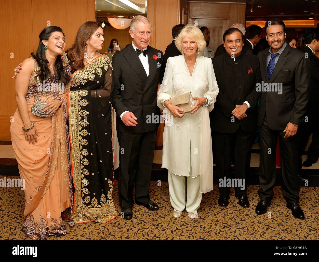 The Prince of Wales and the Duchess of Cornwall with Indian Billionaire Mukesh Ambani (second right) and his wife Nita (second left) and Kajol Devgan (left) and husband Ajay (right), after arriving to attend a charity fund raising dinner in Mumbai India, on the fourth day of their eleven day tour of India and Sri Lanka. Stock Photo