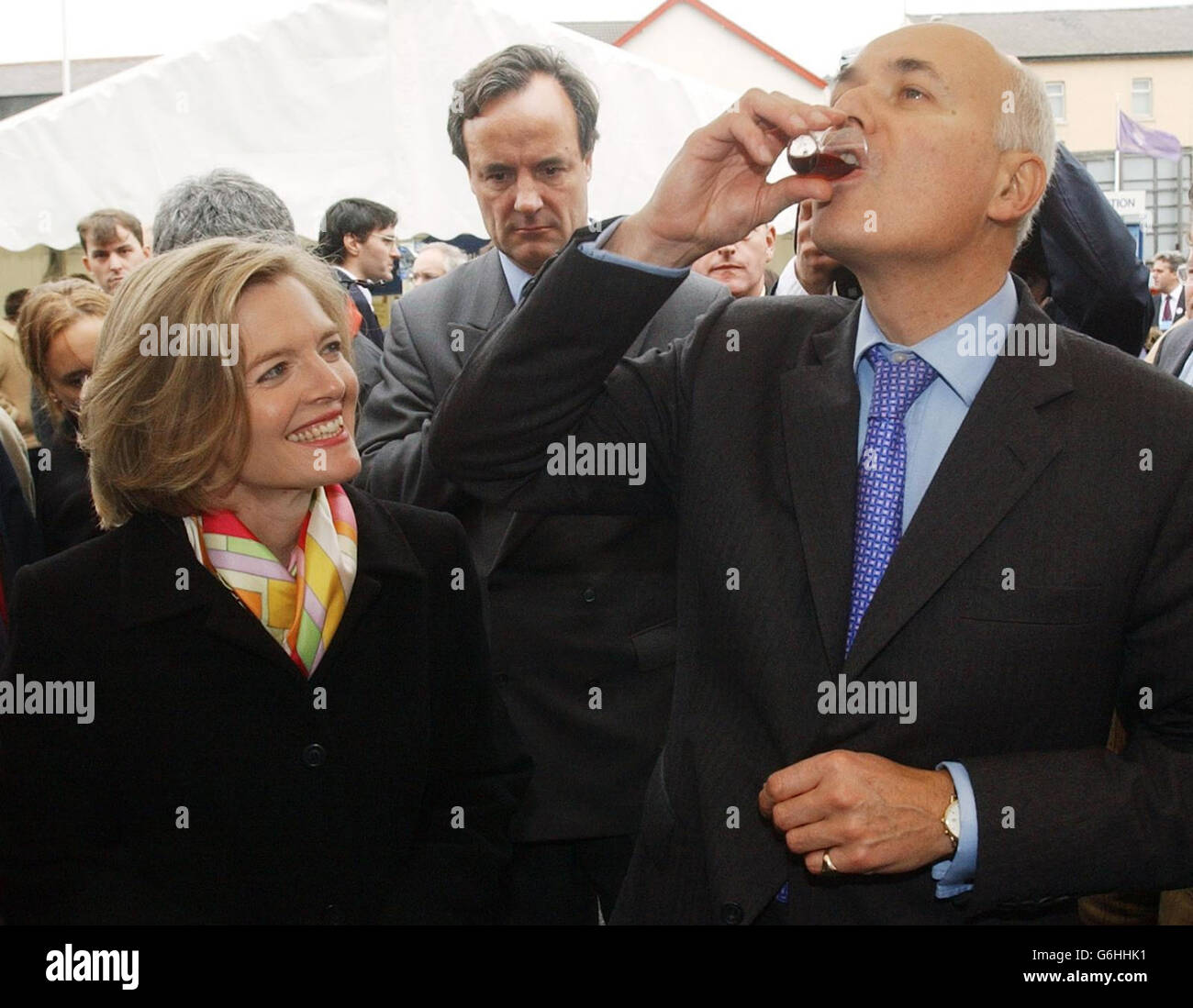 Conservative Party leader Iain Duncan Smith and his wife Betsy sample some gin as they tour a farmers' market in Blackpool. Earlier today, Mr Duncan Smith brushed aside suggestions that the party's 'men in grey suits' were set to call time on his leadership. Amid claims that up to 15 Tory backbenchers were calling for a vote of no confidence in his leadership, Mr Duncan Smith insisted that his focus was on ending Tony Blair's premiership. With the Conservative annual conference in Blackpool entering its second day, focusing upon dissent, Europe and taxation, Mr Duncan Smith insisted he would Stock Photo