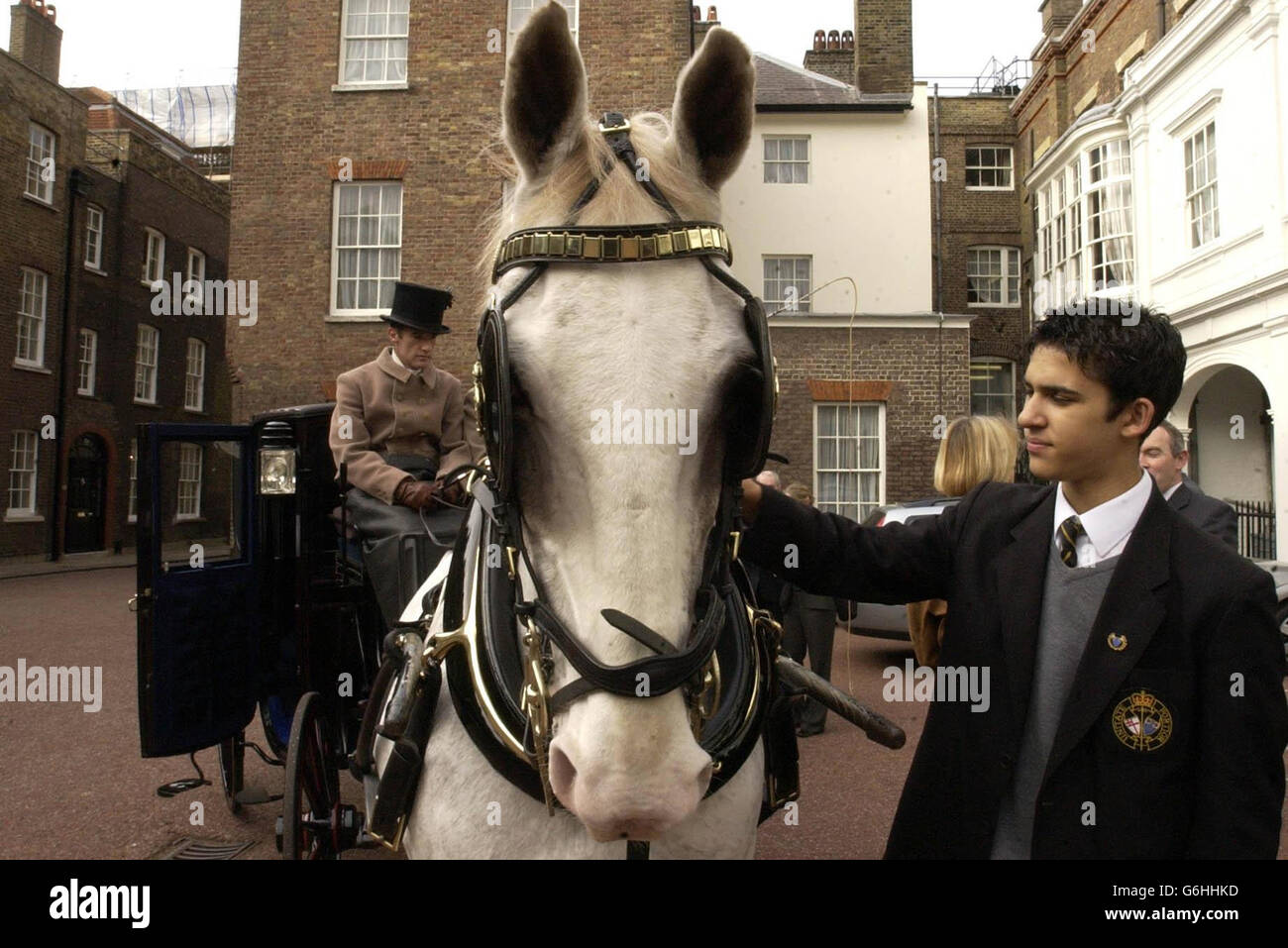 Ben Ryder, a fifteen year old student from Westminster Boys School pats ...