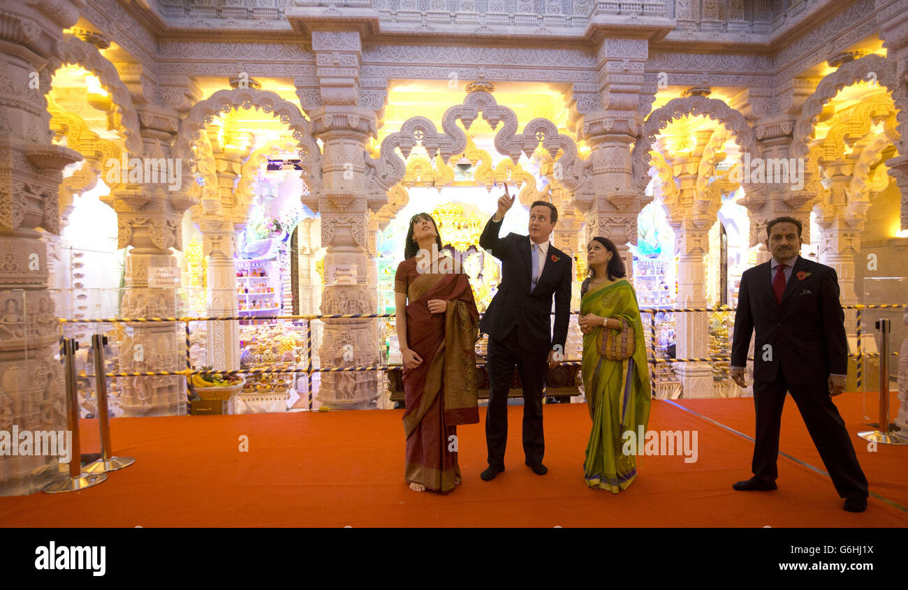 Prime Minister David Cameron, looks up with his wife Samantha, left