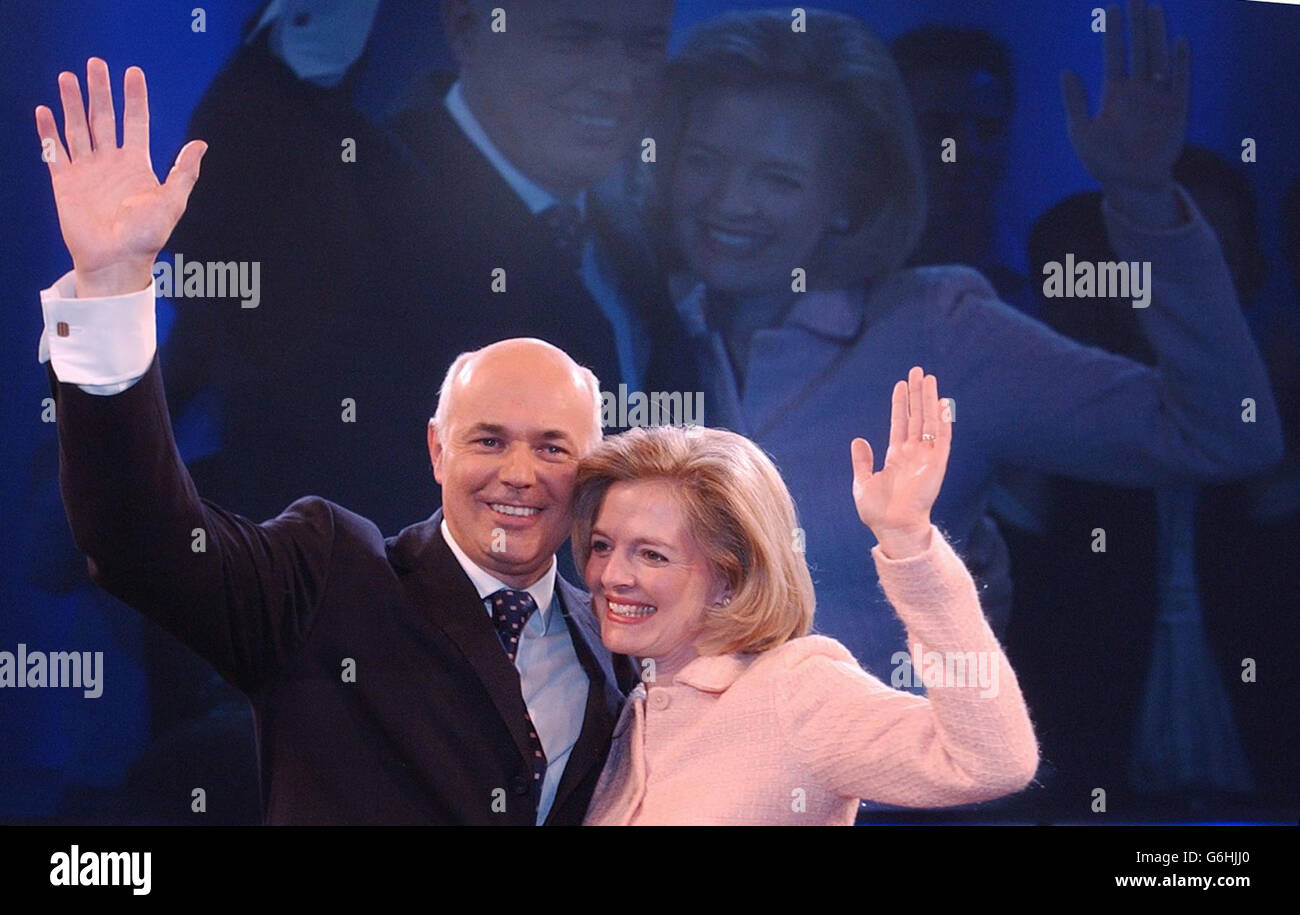 Tory leader Iain Duncan Smith and his wife Betsy receive a standing ovation following his speech to the Conservative Party conference in Blackpool. Mr Duncan Smith today warned his party critics: 'Get on board or get out of our way.' He said he now had 'the most radical policy agenda of any party aspiring to Government since 1979'. And he accused Prime Minister Tony Blair directly of lying over the death of weapons expert Dr David Kelly, saying the scientist had been used by the Government 'as a pawn in its battle with the BBC'. Stock Photo