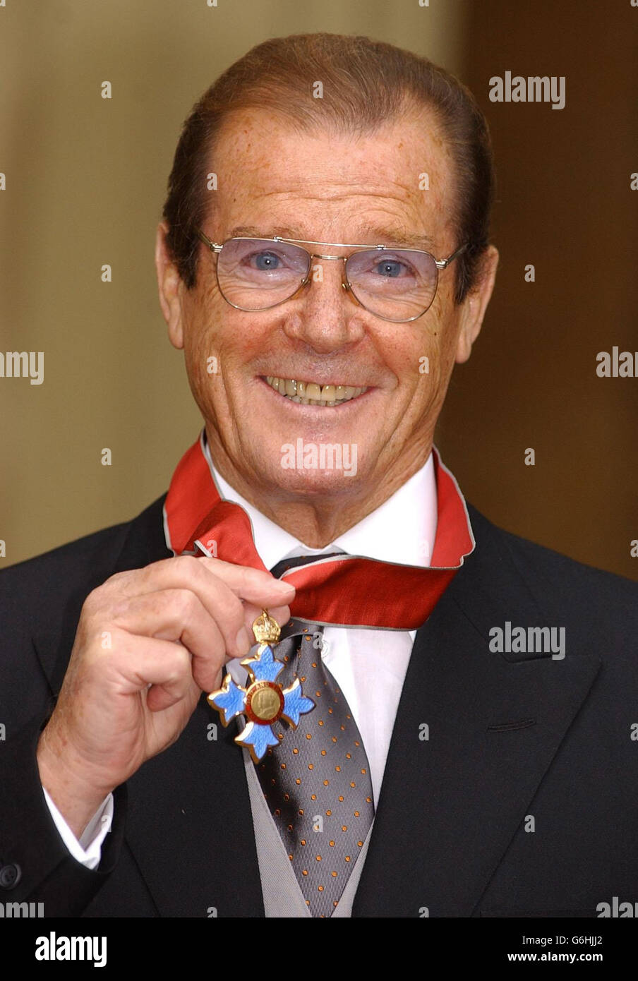 Sir Roger Moore with his knighthood at Buckingham Palace. Moments after  receiving his knighthood from the Queen, the suave superstar said: I had  the worst attack of stage fright in my life.