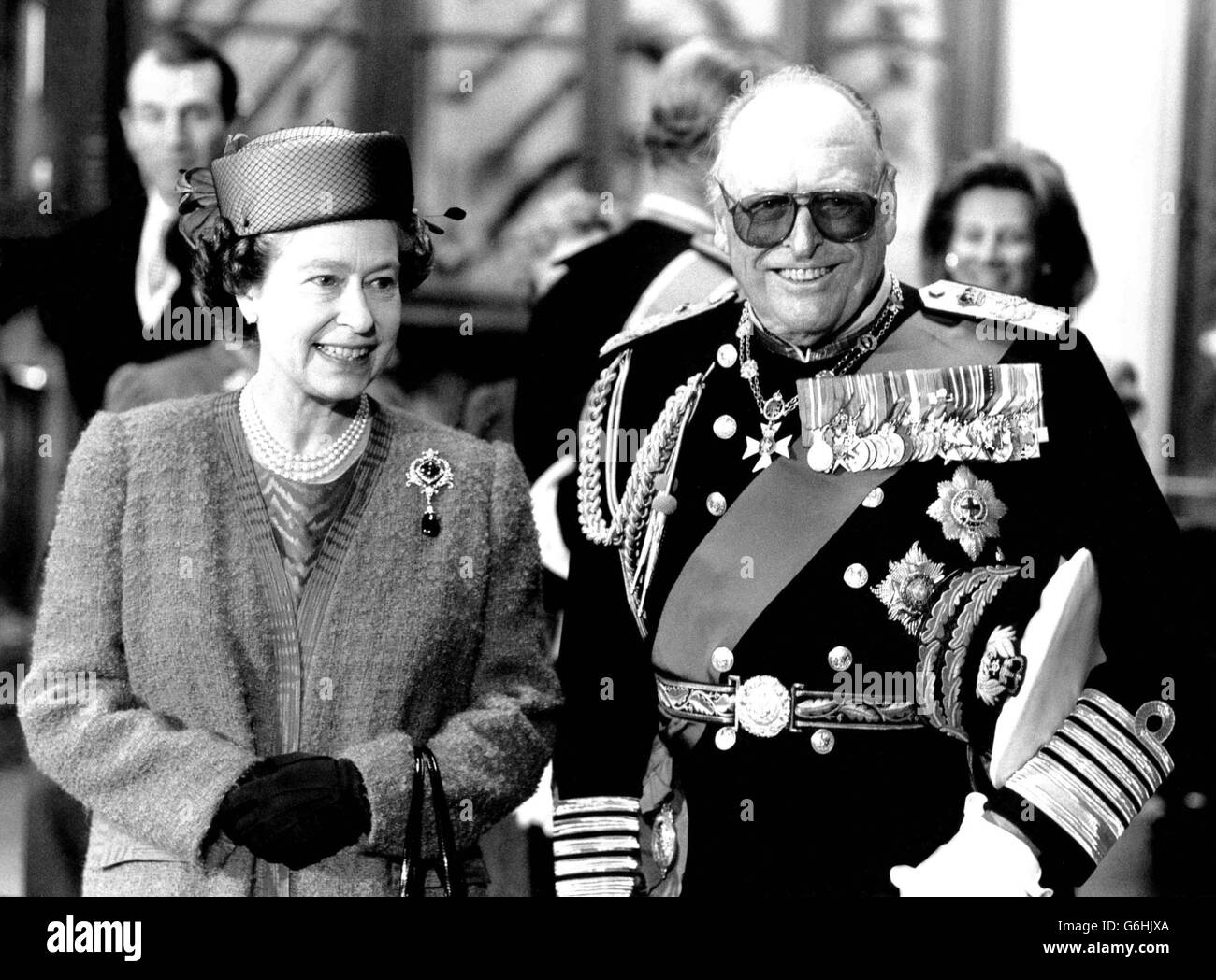 The Queen welcomes her 84-year-old cousin, King Olav of Norway, to Windsor Castle at the start of his four-day State Visit today. Stock Photo