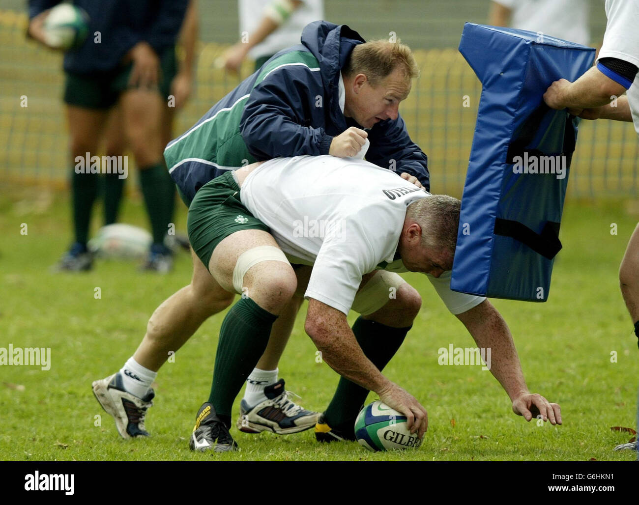 No mobile phone use, Internet sites may only use one image every five minutes during match: Coach Eddie O'Sullivan (left) and Victor Costello during Ireland's training session at the East Coast Grammar School grounds near Gosford, New South Wales, Australia. Stock Photo