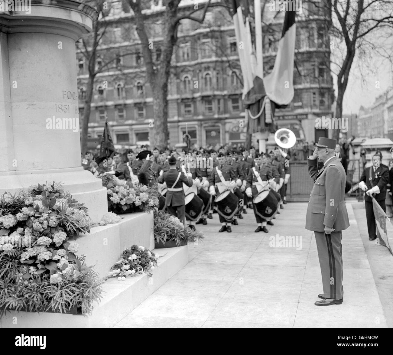 General Charles de Gaulle, President of France, salutes the memory of a great compatriot and fellow-soldier after placing a wreath on the Marshal Foch statue near Victoria Station, London. The President arrived in London on a three day state visit. Stock Photo