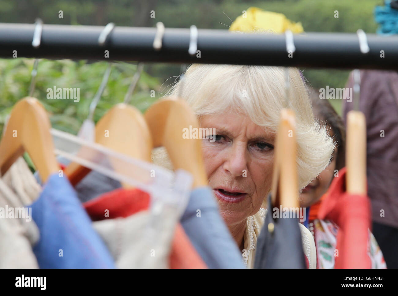 The Duchess of Cornwall views garments while meeting women from SEWA, a self-employed women's cooperative at the High Commisioner's Residence during day 3 of an official visit to India and Sri Lanka. Stock Photo