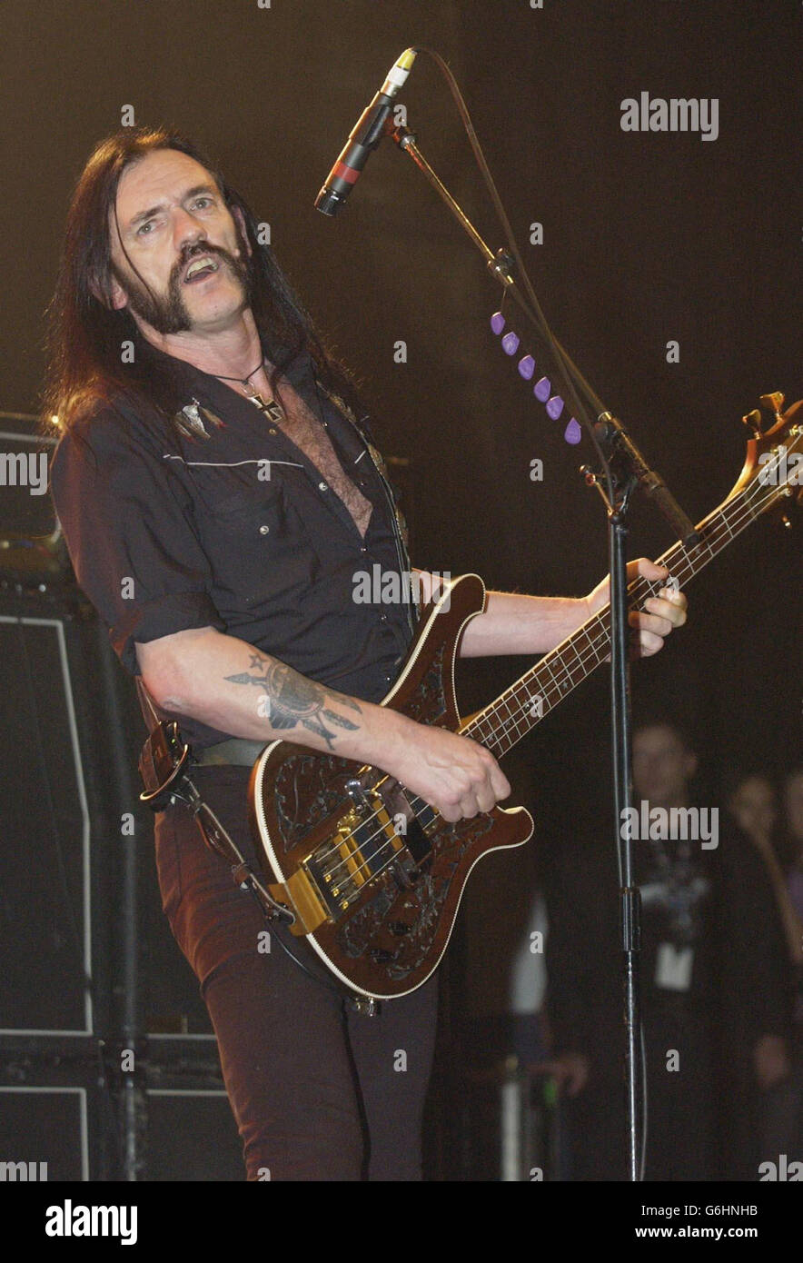 Lead singer Lemmy performs with his band Motorhead on stage at the Carling Hammersmith Apollo in west London. Stock Photo