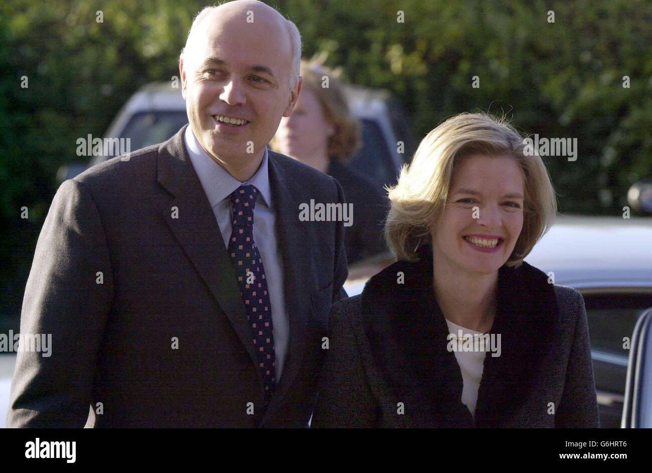Conservative party leader, Ian Duncan Smith, arrives with his wife Betsy for a press conference in Loughborough. Duncan Smith stood defiant today as his policies on student tuition fees were drowned out by a barrage of questions over his leadership crisis - and insisted he would lead the party into power at the next election. 29/03/2004: Mr Iain Duncan Smith has been cleared Monday March 29, 2004, of wrongdoing over the 'Betsygate' row after the Committee on Standards and Privileges dismissed complaints that he improperly employed his wife as a secretary. Stock Photo