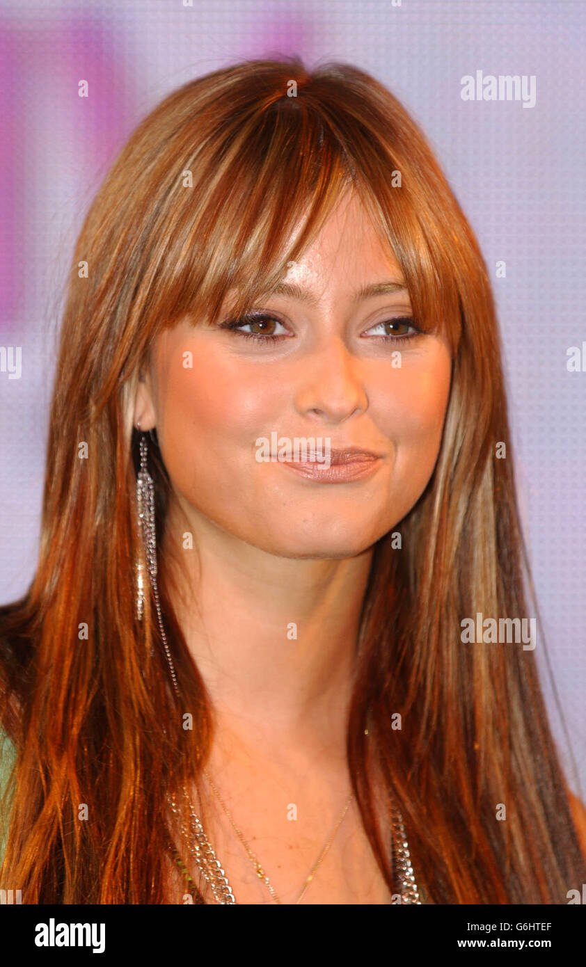 Australian singer Holly Valance performs her new single 'State of Mind' during a special appearance at HMV Music store in Oxford Street, central London. Stock Photo