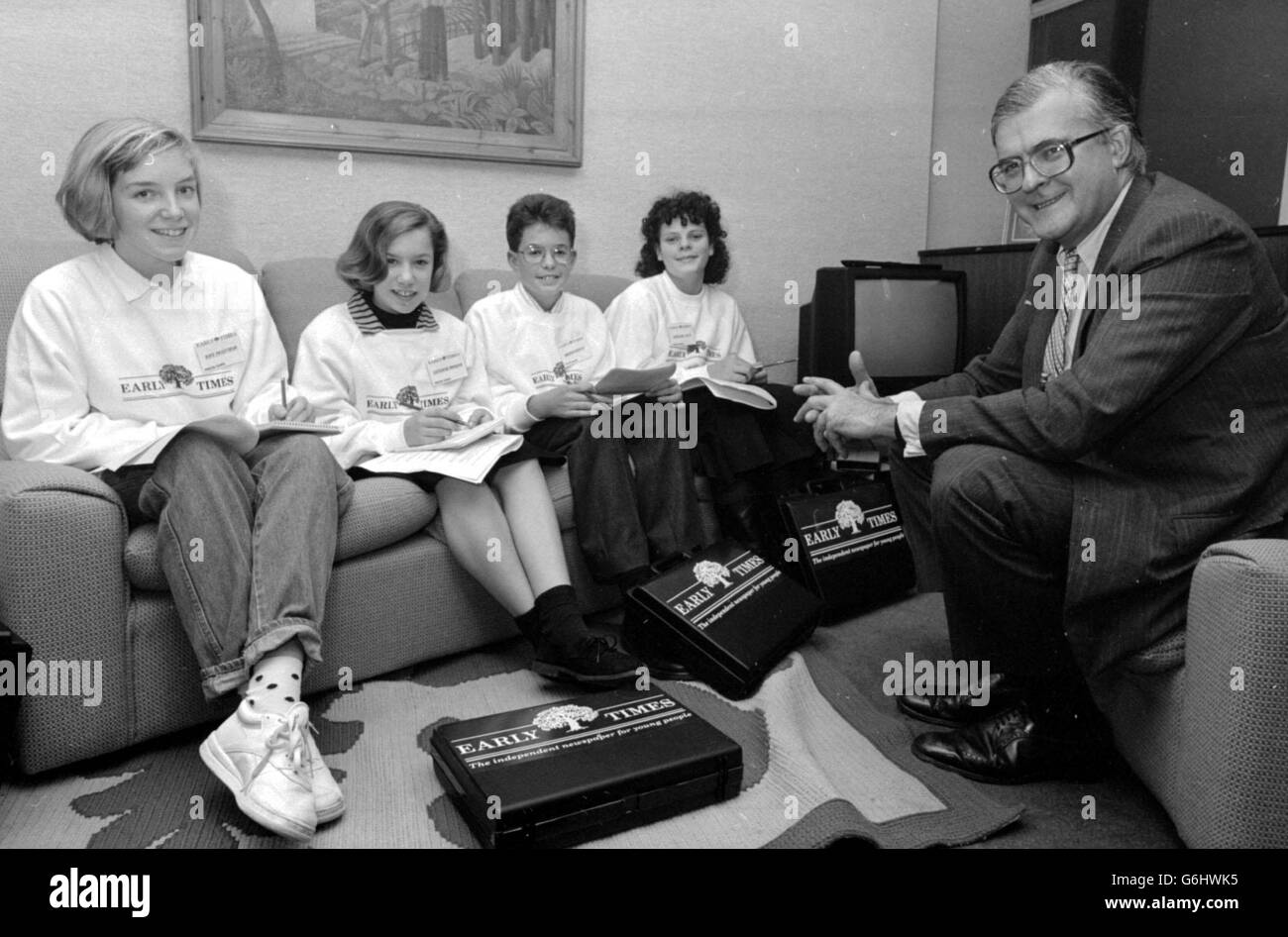 Education Secretary Mr Kenneth Baker is put on the spot by cub reporters from the young people's newspaper, Early Times, when they interviewed him at the Department of Education in London. * L to R: Kate Priestman, 14, from Birmingham; Catherine Morgan, 12 of Chesterfield; Andrew Morgan, 15 from Plymouth and Catherine Hillis, 13 of Chester. Stock Photo