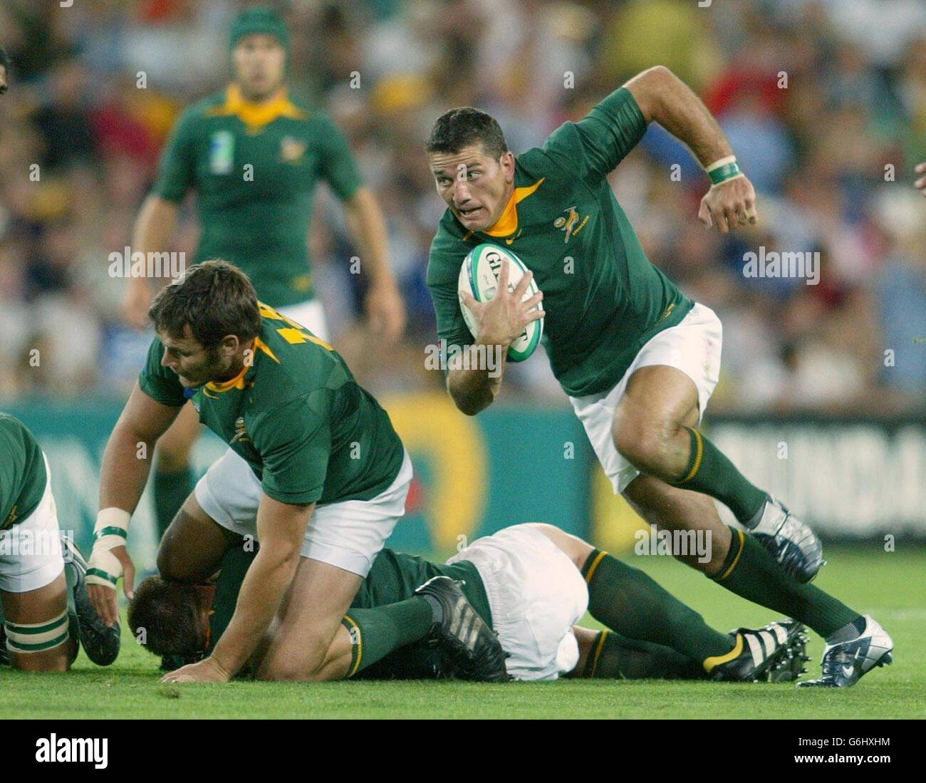 South Africa's Joost van der Westhuizen runs with the ball during the Rugby World Cup match at the Suncorp Stadium in Brisbane, Australia. : Stock Photo