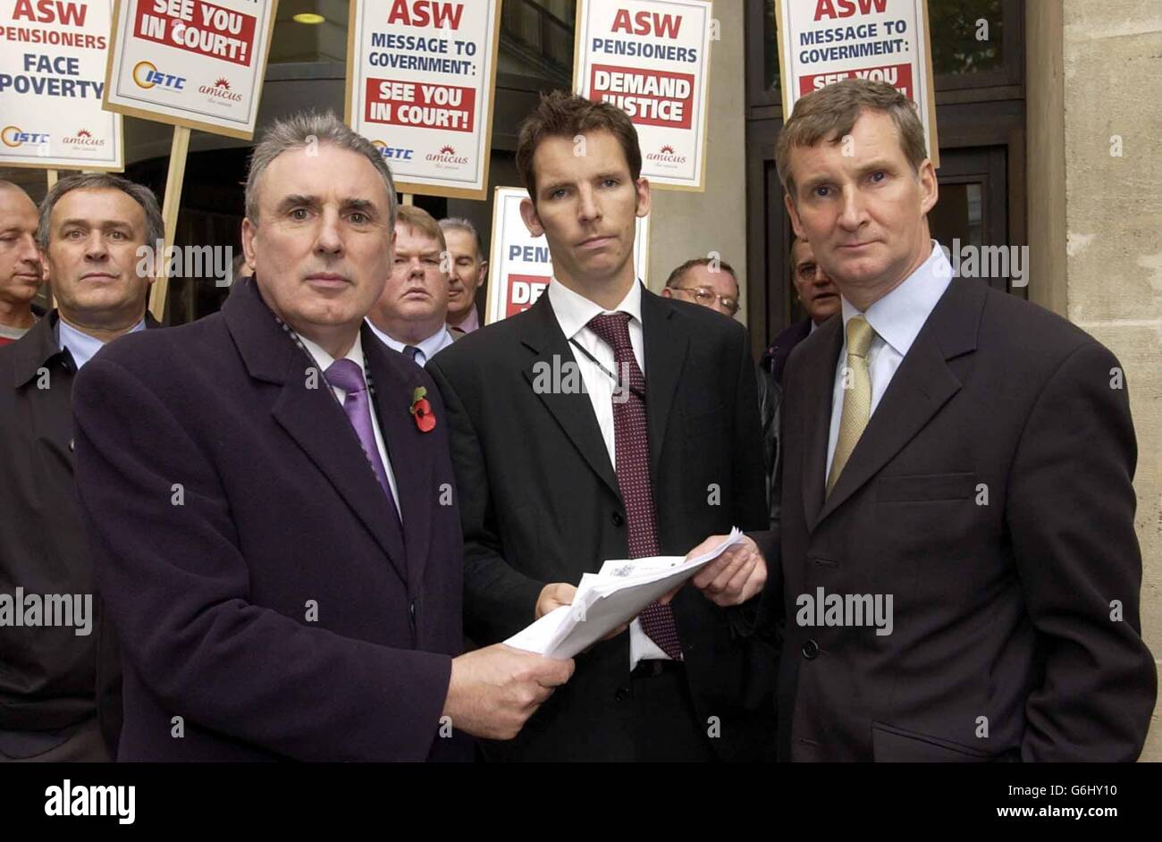 ISTC General Secretary Michael Leahy (left) and Amicus Assistant General Secretary Paul Talbot (right) outside Richmond House, Whitehall accompanied by former ASW workers, as they deliver a writ to the Department of Work and Pensions headquarters in London. The unprecedented action is being taken in support of 1,000 workers who lost their jobs earlier this year when steel firm ASW, which had factories in Cardiff and Sheerness, Kent, fell into receivership. Stock Photo