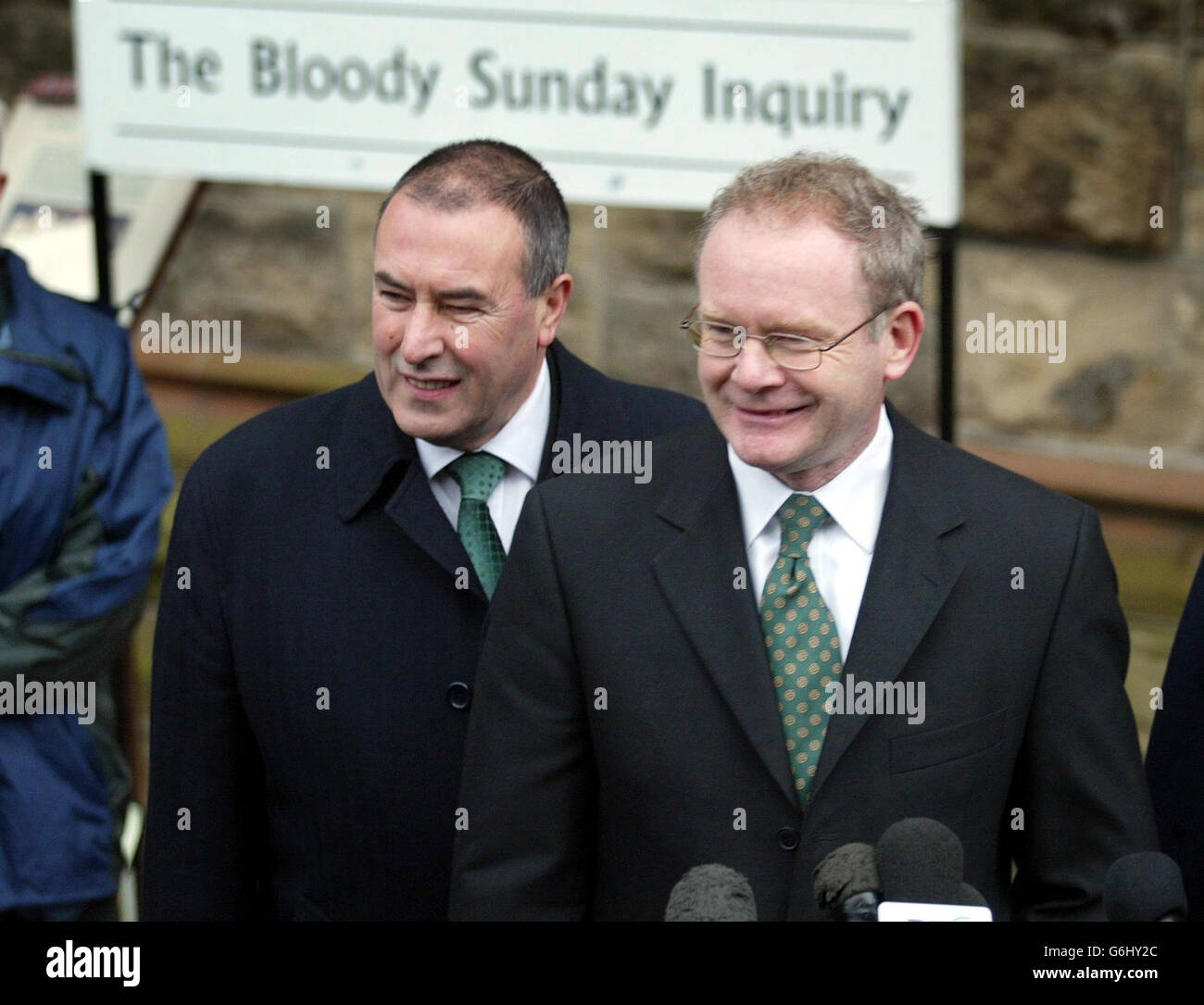 Sinn Fein's Martin McGuinness (right) arriving at the Guildhall in Londonderry with Mitchell McLaughlin to give evidence to the Bloody Sunday inquiry. Mr McGuinness, who has admitted being second in command of the IRA on Bloody Sunday, said he was at the Saville Inquiry to tell the truth about the 1972 killings by the British army in the city. Stock Photo