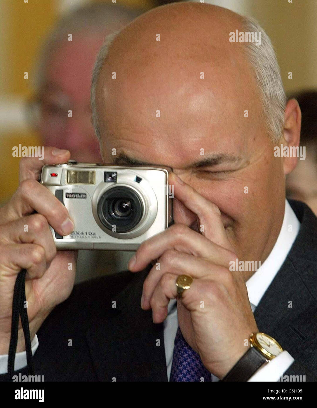 Consevative Party leader Iain Duncan Smith tries his hand at digital photography during his visit to the Frank Townend Community Centre in Blackpool ahead of the start of his party's annual conference. Stock Photo