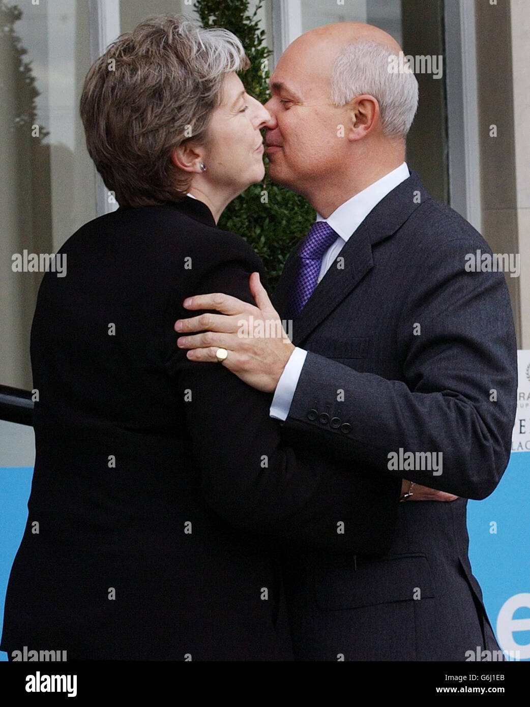 Conservative Party leader Iain Duncan Smith is greeted by party chairman Theresa May as he arrives at his hotel in Blackpool, on the eve of his party's annual conference. Tories pledged to increase the basic state pension in line with average earnings if they were returned to power, in a bid to grab the vital "grey vote" in the upcoming general election. The conference is also expected to see the announcement of a scheme for US-style elected sheriffs to run local police units, and the publication of a document setting out the basis of the party's manifesto for the next General Election. Stock Photo