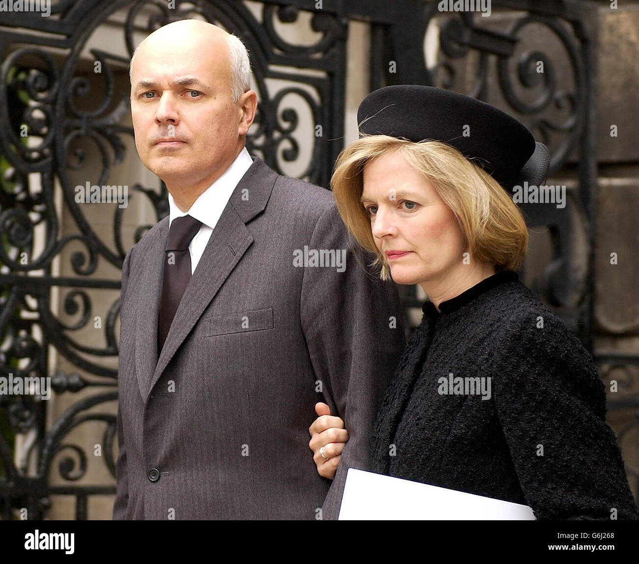 Tory leader Iain Duncan Smith and his wife Betsy leave the service of remembrance, at St Pauls Catherdral, central London, in honour of those who died in the Iraq war. The service is being addressed by the Archbishop of Canterbury, Dr Rowan Williams. There will also to be a minute's silence, led by Bishop to the Forces the Rt Rev David Conner, with a bugler sounding the Last Post. Stock Photo