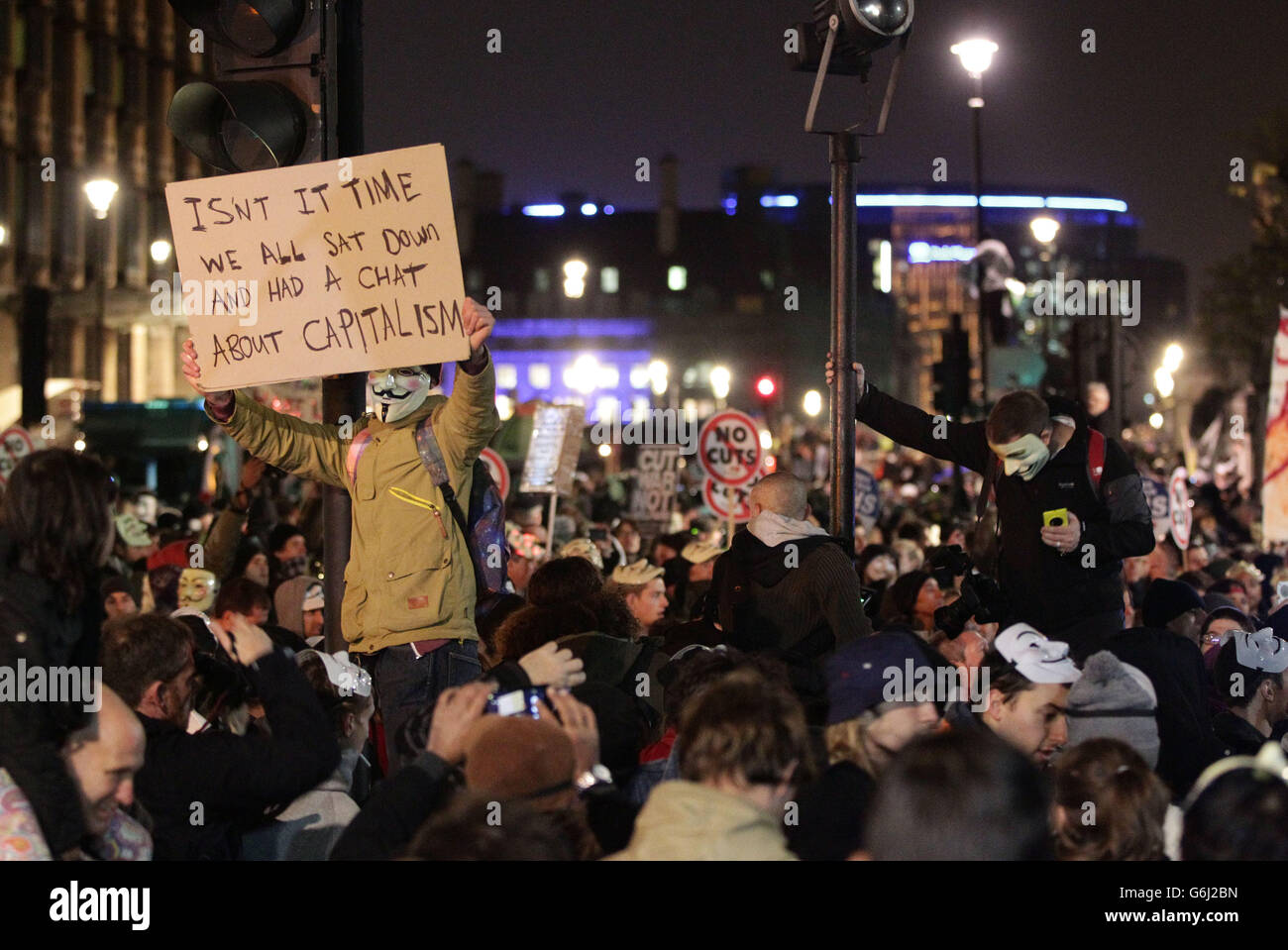 Protesters demonstrate as part of the Bonfire of Austerity protest outside the Houses of Parliament in central London. Stock Photo