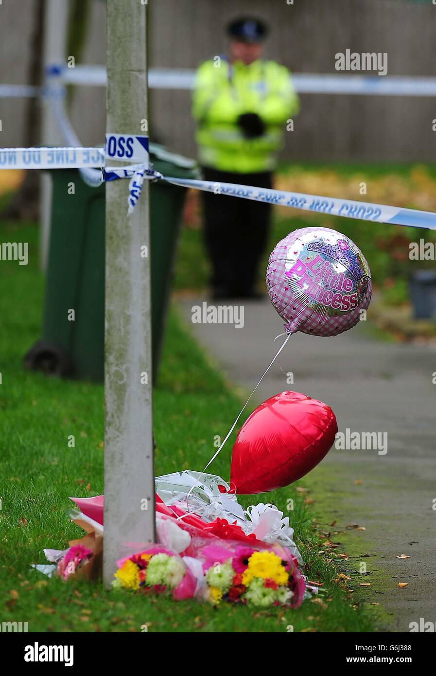 Floral tributes outside the home in Rowena Court in Mountsorrel, Leicestershire where Lexi Branson, four, died after being bitten by a dog. Stock Photo
