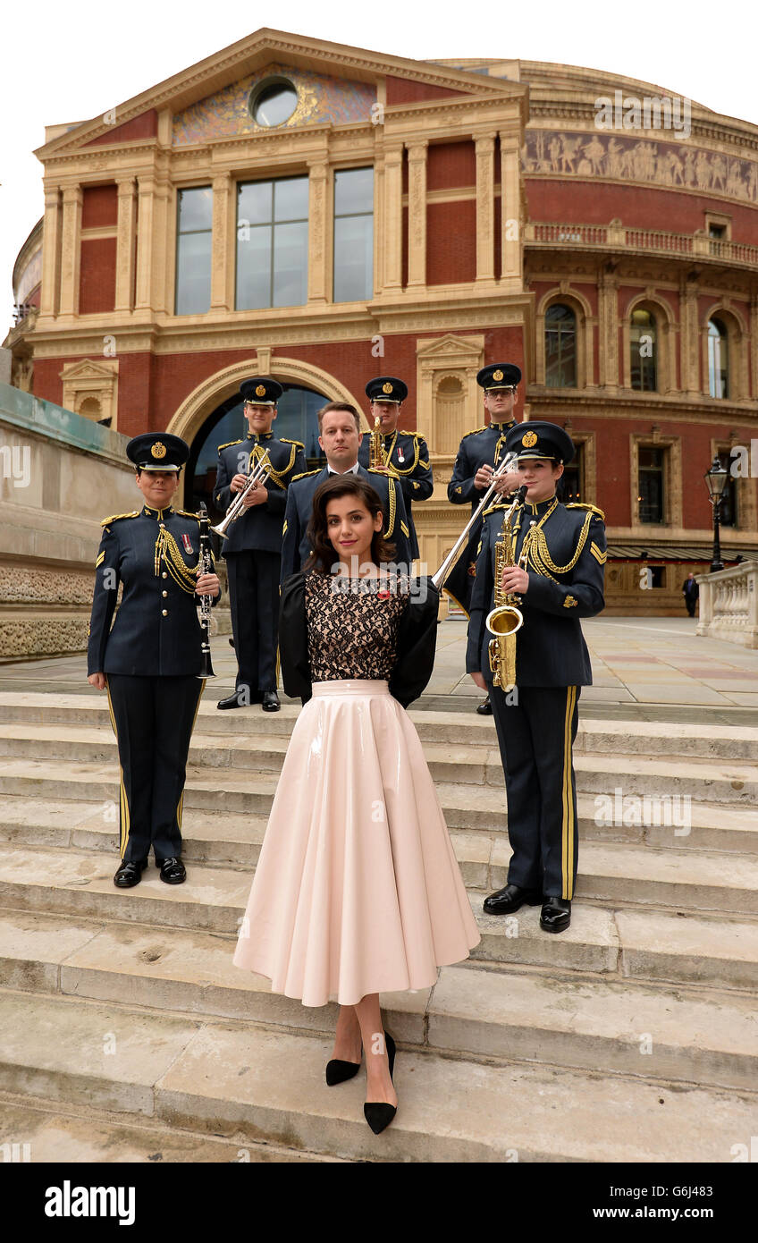 Katie Melua (centre) with members of the Central Band of the RAF (left to right) Corporal Louisa Sims, Senior Aircraftman Ed Carpenter, Corporal Matt Walker, Corporal Andy Mears, Senior Aircraftman Josh Hayward and Corporal Claire Tidbury, outside the Royal Albert Hall during rehearsals for tomorrow's Royal British Legion Festival of Remembrance. Stock Photo