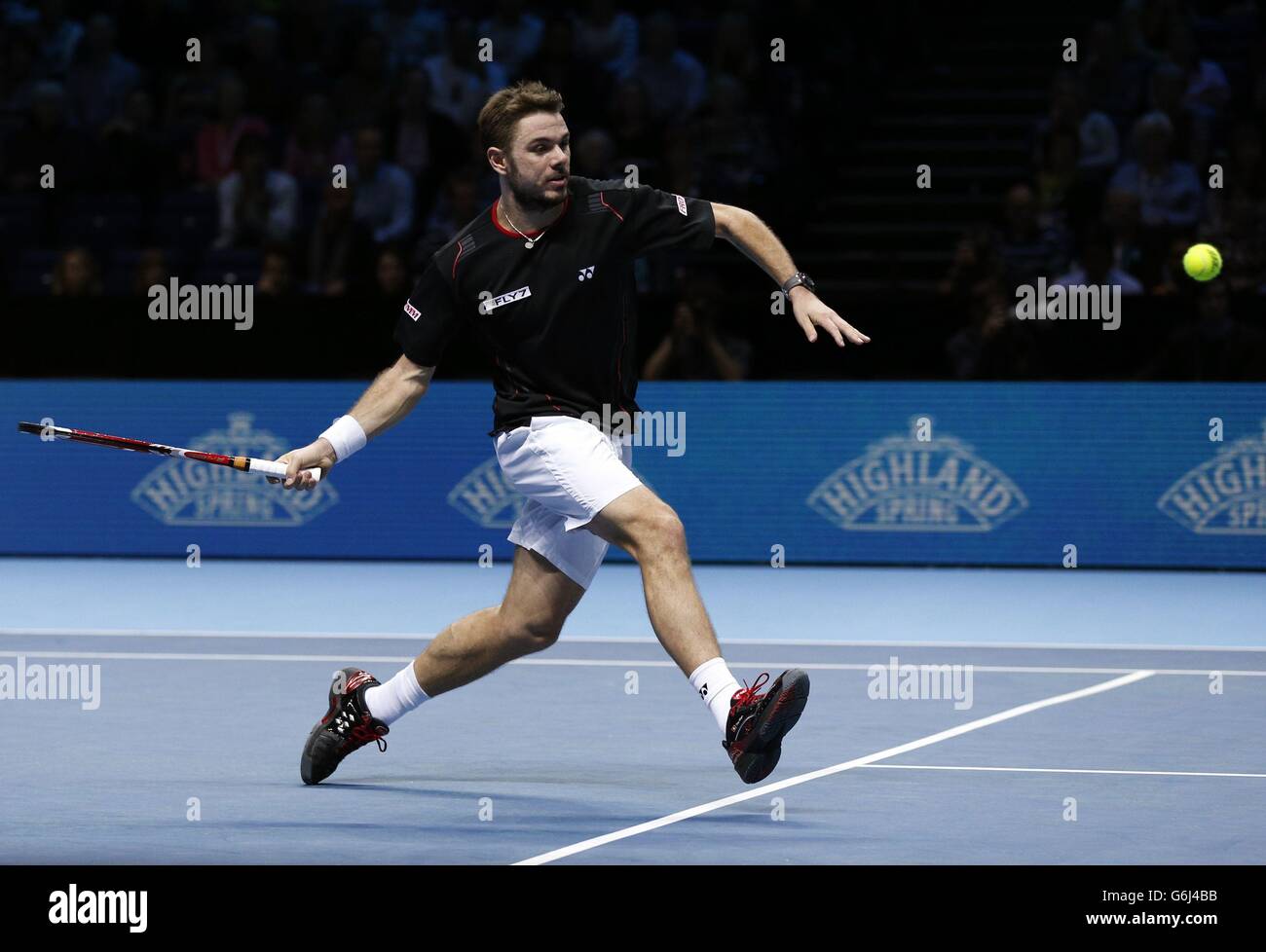 Stanislas Wawrinka competes against David Ferrer during day five of the Barclays ATP World Tour Finals at the O2 Arena, London. Stock Photo