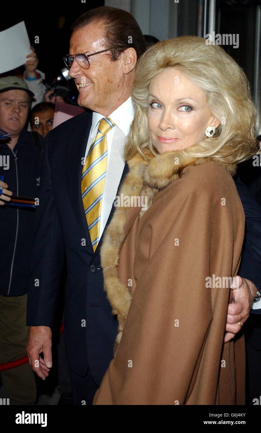 Sir Roger Moore and wife Kikii, arrive for the Shumi restaurant launch party in central London. The Italian eaterie is part-owned by his son Geoffrey and is influenced by the Japanese eating style. Stock Photo