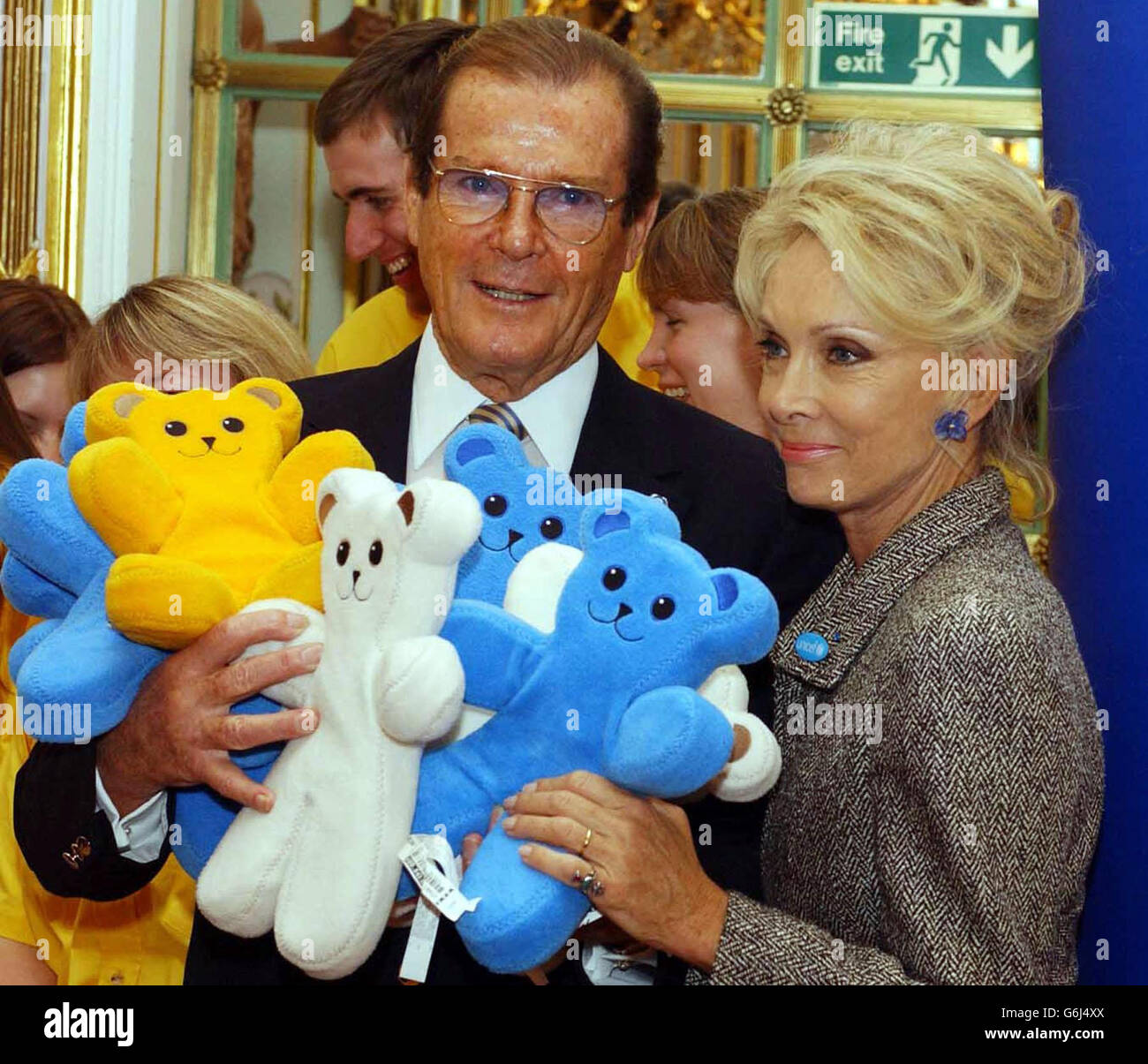 Sir Roger Moore, recently knighted for his work as Goodwill Ambassador for UNICEF, and his wife Christine support IKEA's current fundraising initiative for UNICEF. IKEA and UNICEF aim to help raise 3 million euros through sales of the soft toy BRUM Bear to help children affected by armed conflicts in Angola and Uganda. Stock Photo