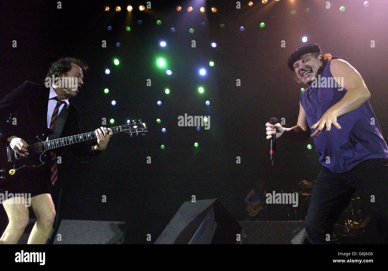 Australian heavymetal band AC/DC's lead guitarist Angus Young (left) and singer Brian Johnson performing live in concert at the Carling Hammersmith Apollo in west London. Stock Photo