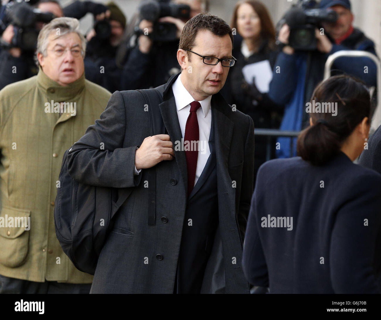 Former News of the World Editor Andy Coulson (centre) arrives at the Old Bailey as the phone hacking trial continues. Stock Photo