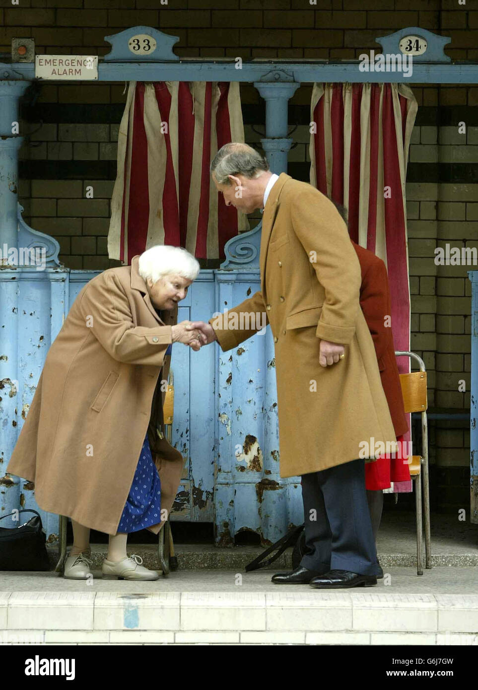 The Prince of Wales (right) meets with Sunny Lowry, 92, the first woman to swim the English Channel and winner of the BBC television programme Restoration at the Victoria Baths in Manchester. The Baths, built between 1903 and 1906, are to receive 3.38 million to help restore the Turkish Bath suite. Stock Photo