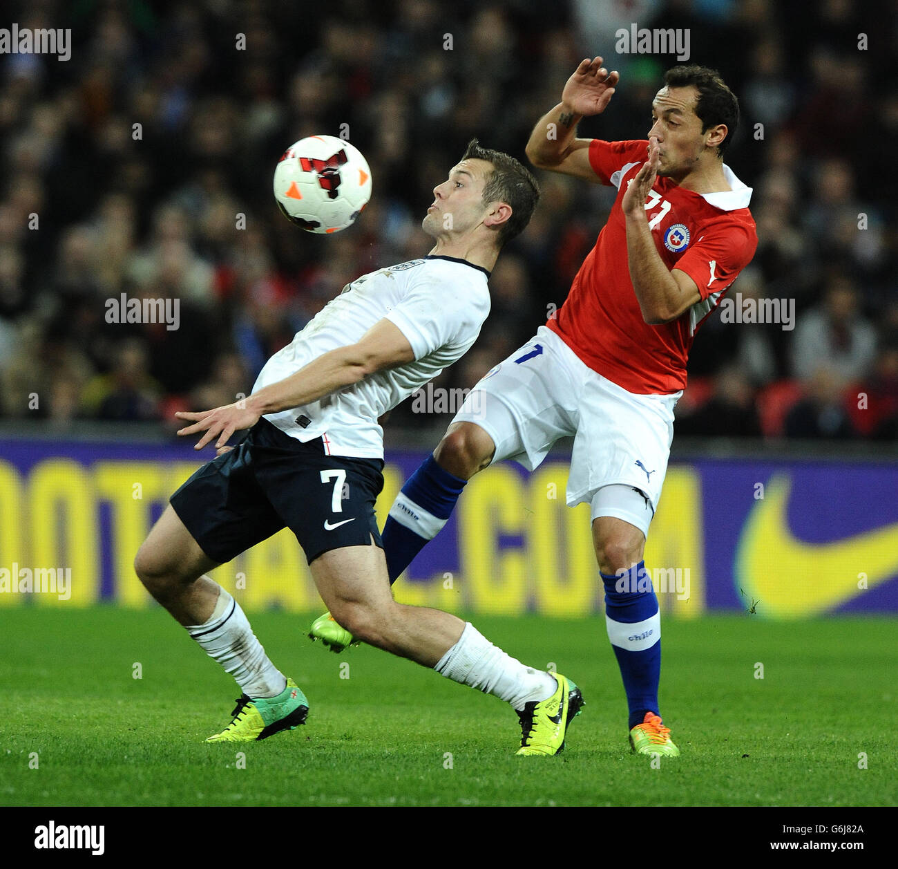 England's Jack Wilshere controls the ball as he is challenged by Chile's Marcelo Diaz Stock Photo