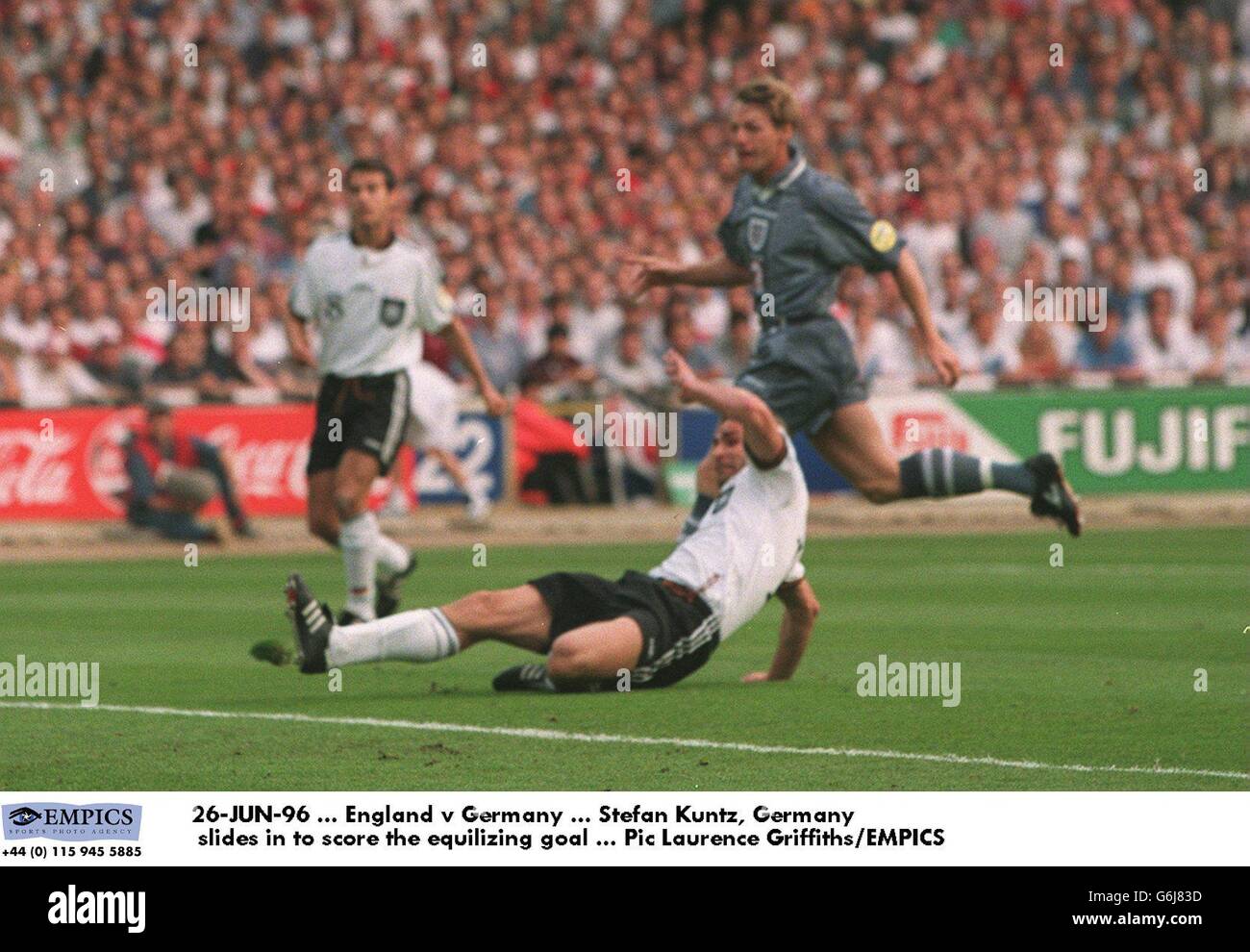 Soccer - Euro 96 - Semi Final - England v Germany. Stefan Kuntz of Germany slides in to score the equalizing goal Stock Photo