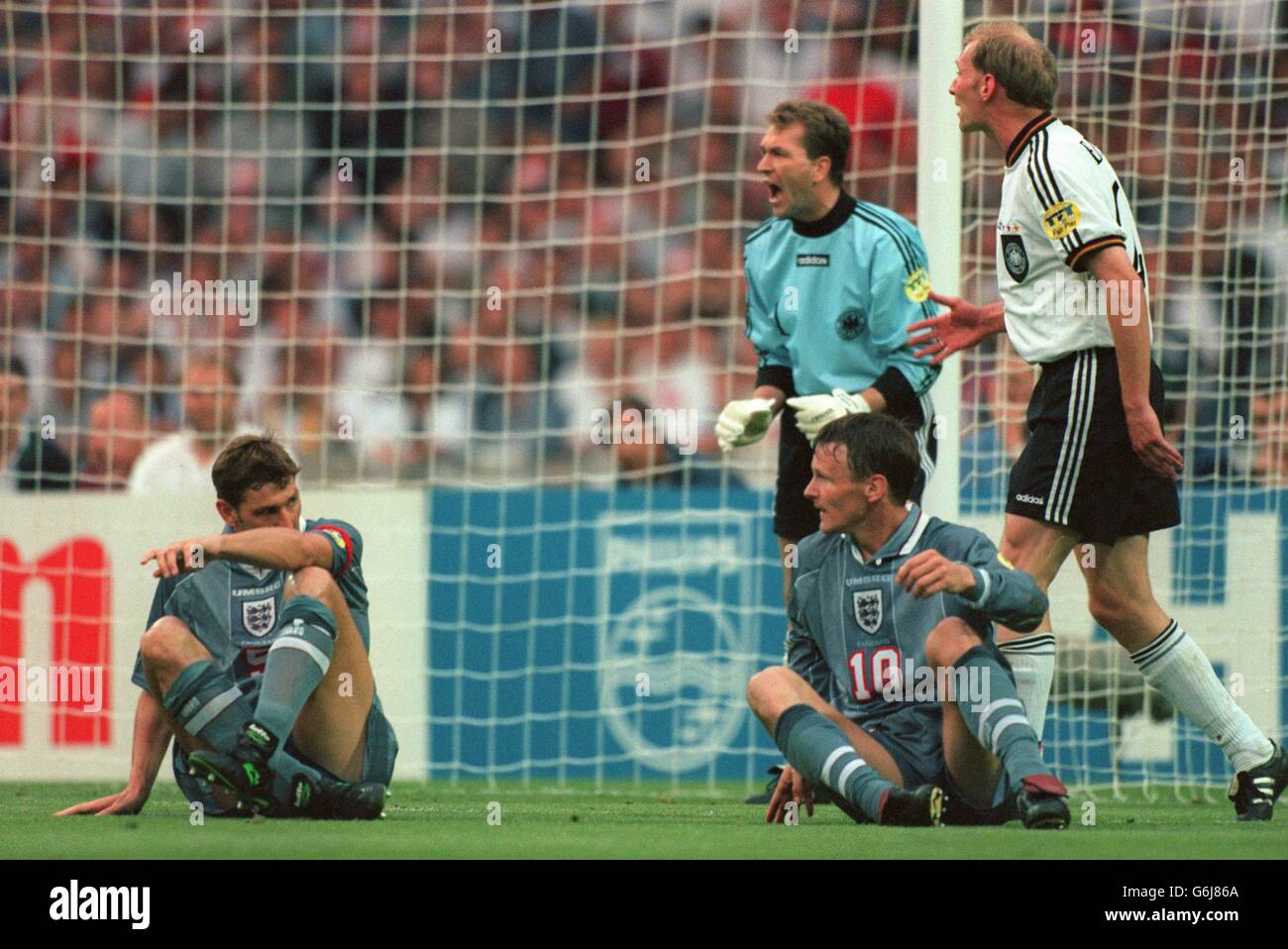 Soccer Euro 96 ... England v Germany ... Wembley. England's Tony Adams and Teddy Sheringham sit on the floor as England miss a chance Stock Photo