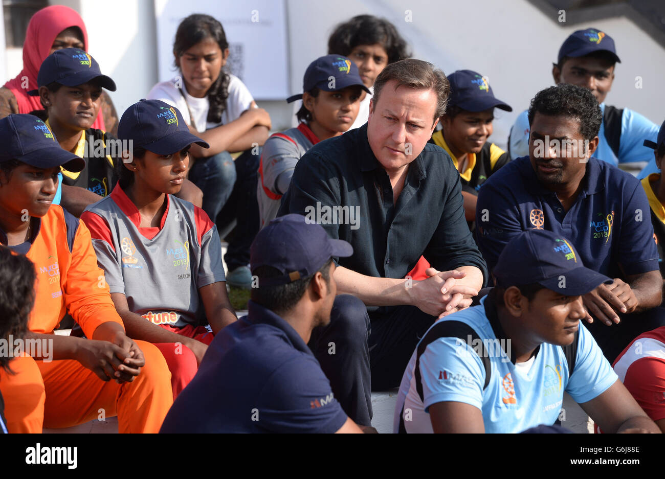 Prime Minister David Cameron visits Colombo's National Cricket Academy where former Sri Lankan cricketer Muttiah Muralitharan runs a charity bringing young people from both sides of the Sri Lankan communities together by playing cricket, the Prime Minister is visiting Sri Lanka to attend the Commonwealth Heads of Government Meeting. Stock Photo