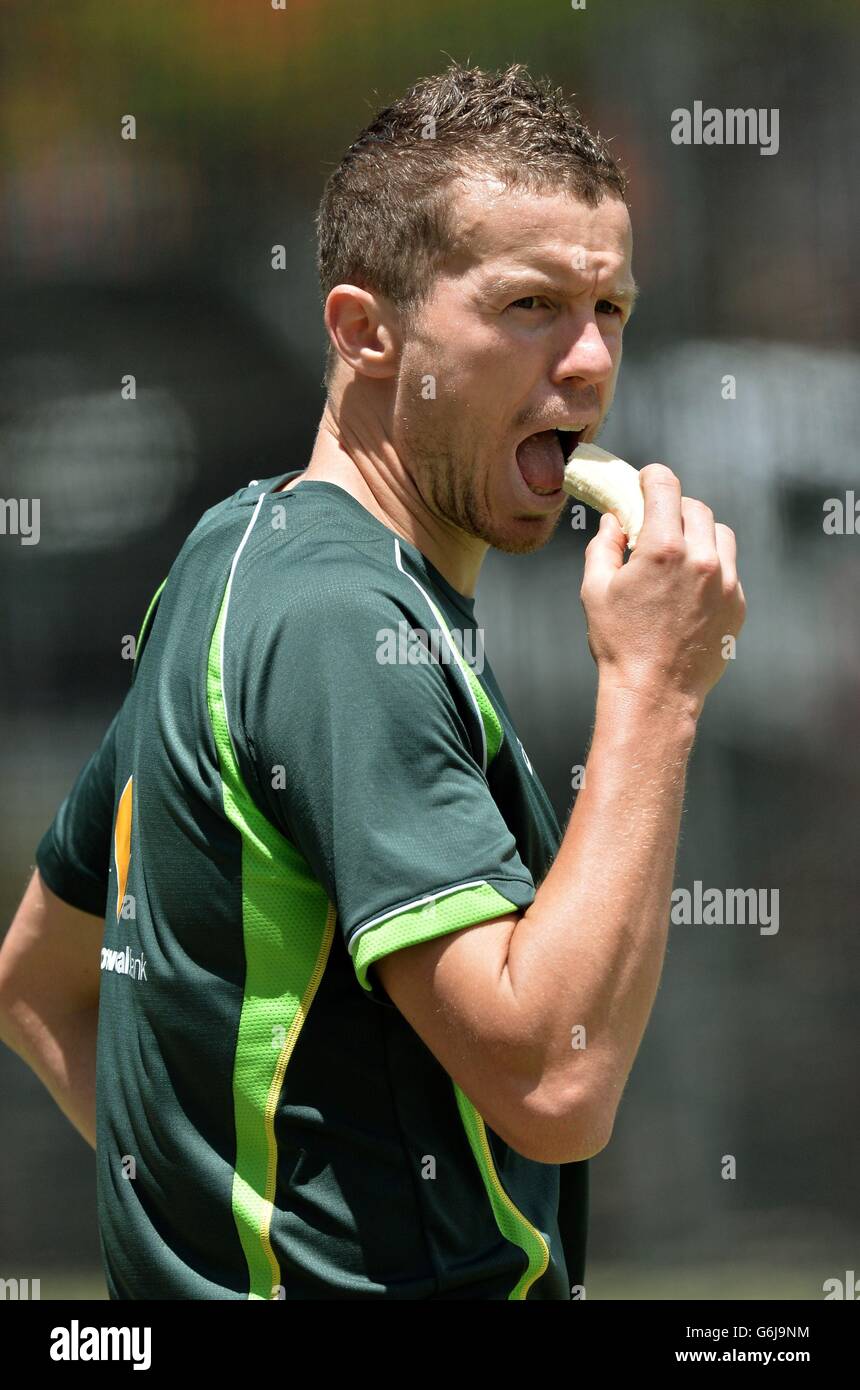 Australia's Peter Siddle eats a banana during the nets session at The ...