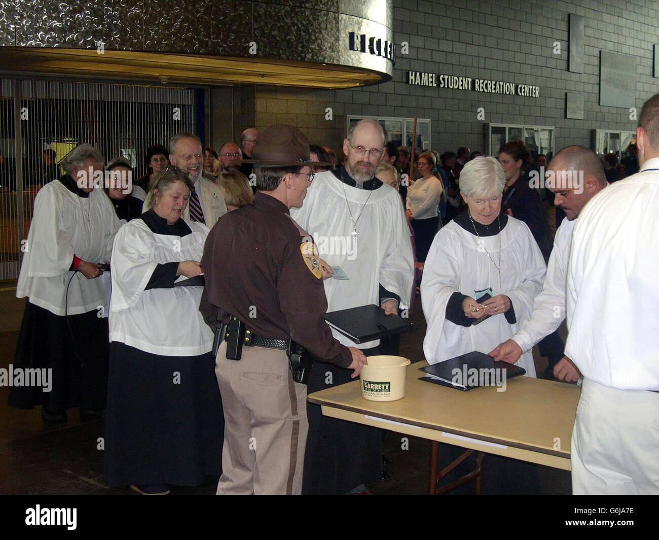 Members of the congregation and clergy pass through tight security as they enter the Whittemore Center Arena at the University of New Hampshire, Durham, USA for the consecration of the first ever openly gay Anglican Bishop Gene Robinson. Stock Photo