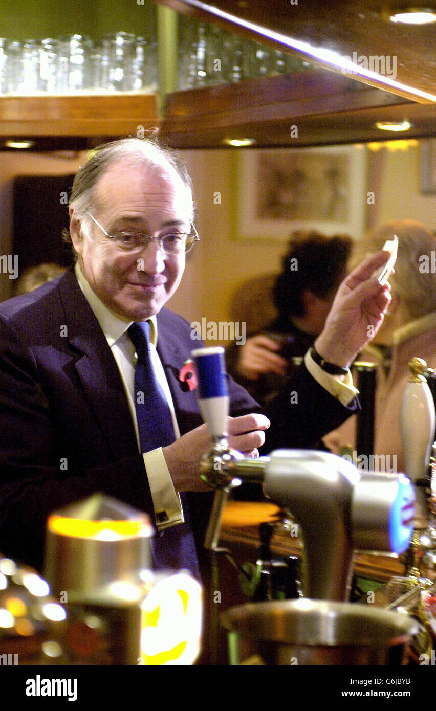 New Conservative Party leader Michael Howard serves from behind the bar at the Kings Head in Hythe. Mr Howard was this weekend putting the finishing touches to his shadow cabinet following his unopposed election on Thursday. Stock Photo