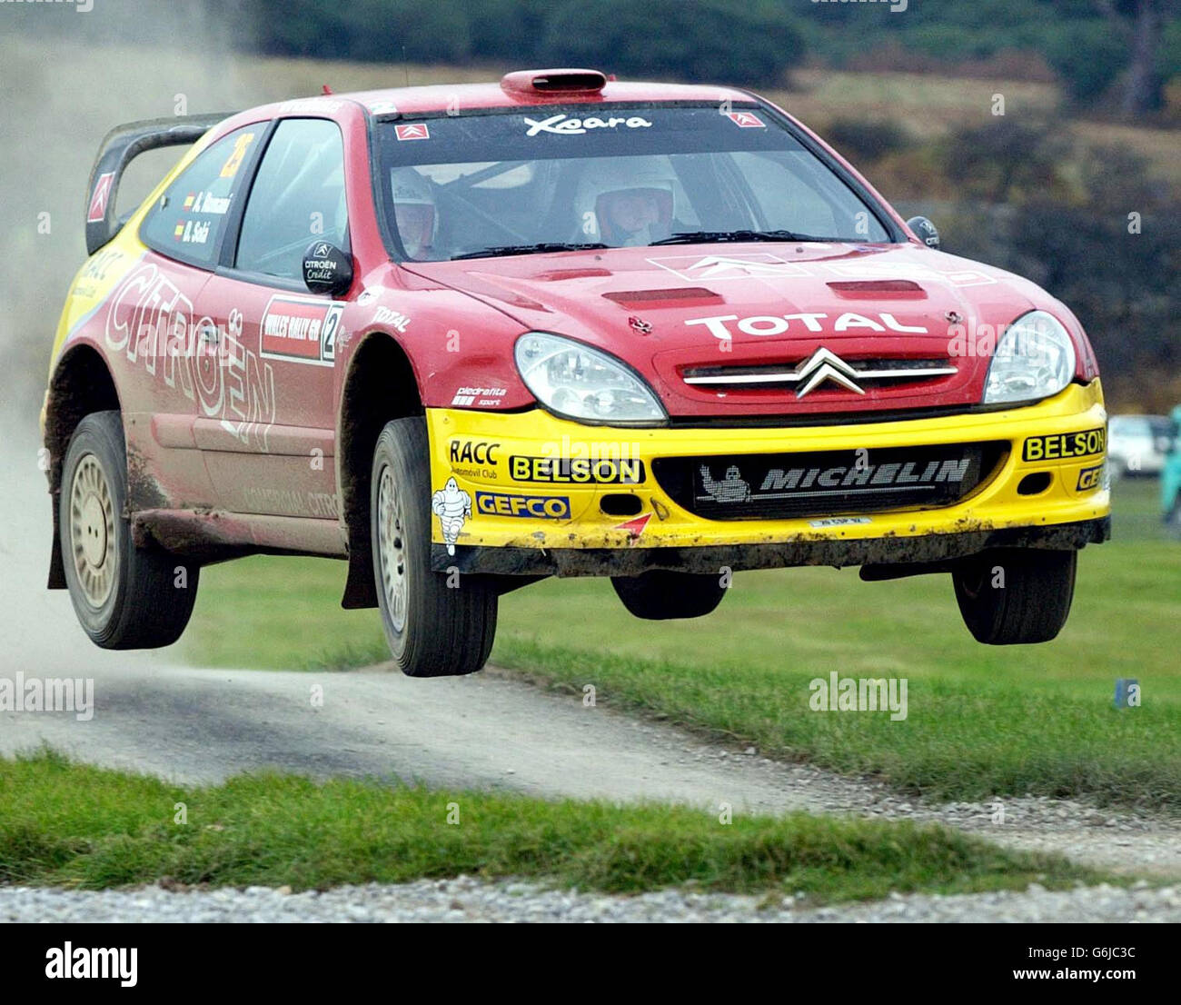 Spain's Daniel Sola and Alex Romani driving a Citroen Xsara, in mid-air during the Wales Rally GB special stage at Margam Park, South Wales. Stock Photo