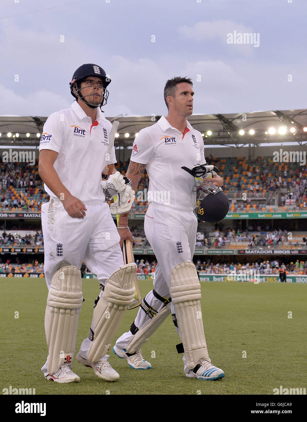 England S Alastair Cook Left And Kevin Pietersen Right Look On As The Players Leave The Field At The Close Of Play During Day Three Of The First Ashes Test At The Gabba Brisbane
