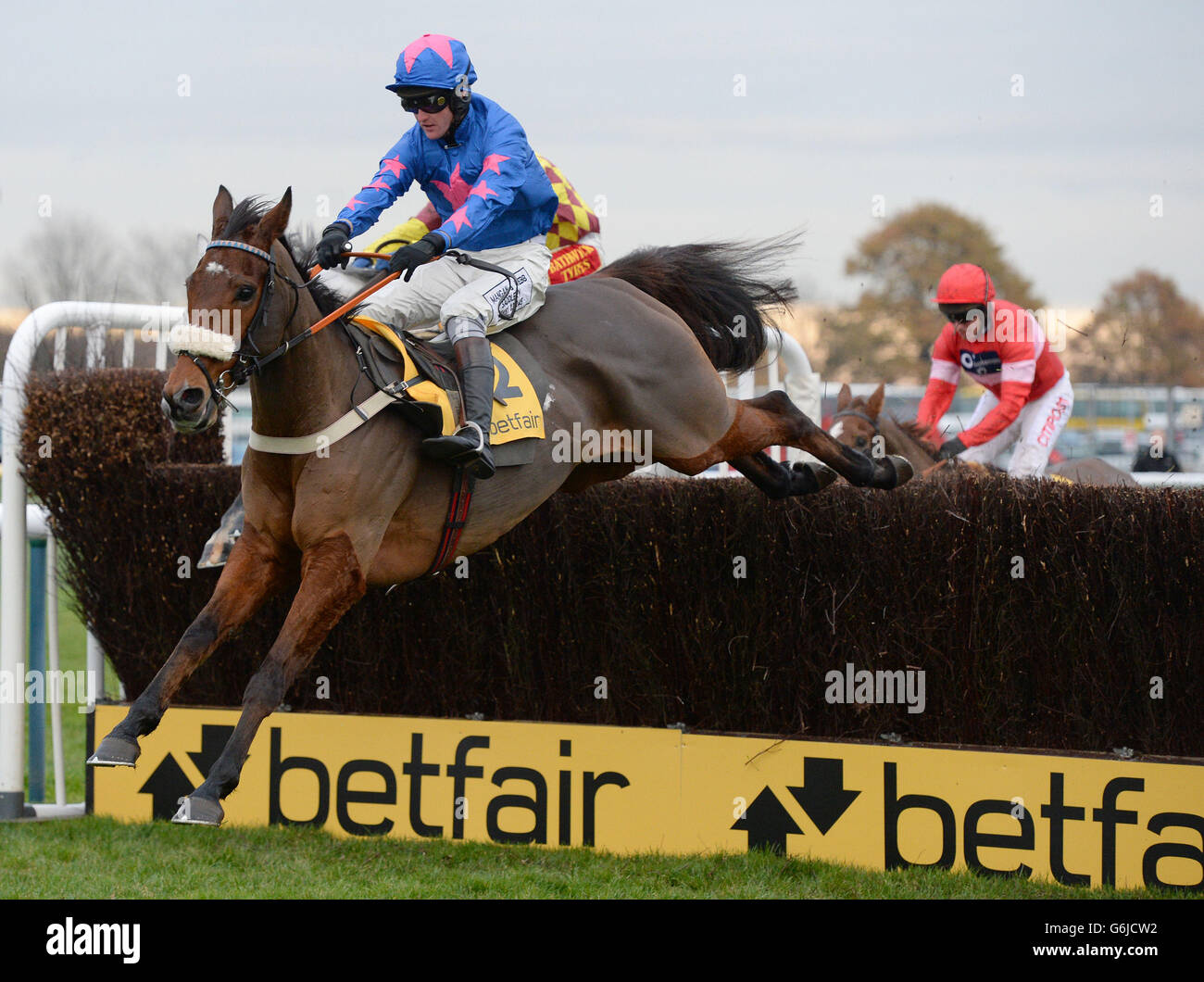 Cue Card and Joe Tizzard on their way to victory in the Betfair Chase during the Betfair Chase Festival at Haydock Park Racecourse, Newton-le-Willows. Stock Photo