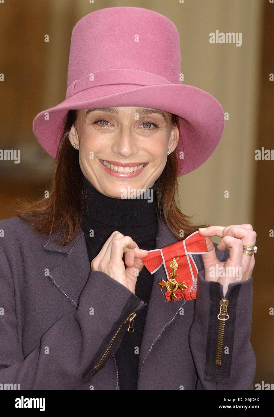 Actress Kristin Scott Thomas with the OBE medal she received at Buckingham Palace, London. Stock Photo