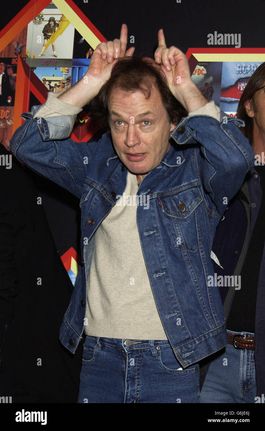 Angus Young from Rock group AC/DC poses for photographers at Carling ...