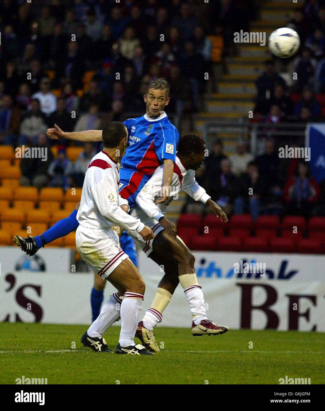 EDITORIAL USE ONLY. Inverness's David Bingham (centre) scores the first