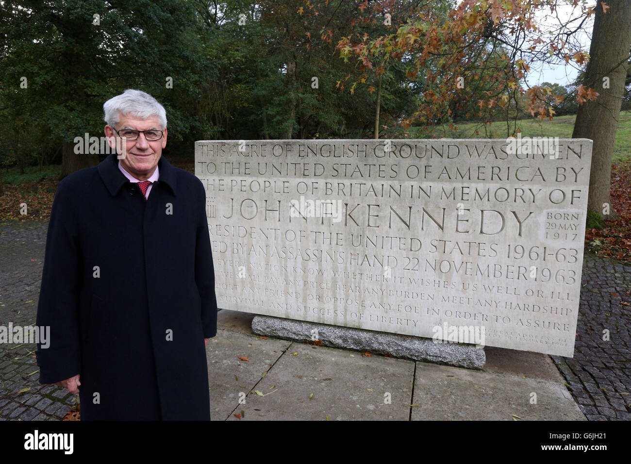 Professor Tony Badger, chairman of the Kennedy Memorial Trust and Master of Clare College Cambridge stands next to the memorial for former US President John Kennedy in Runnymede near Egham, Surrey. As the world marks the 50th anniversary of the death of JFK, Britain's commemorations will centre on a simple wreath-laying ceremony at the UK memorial dedicated to the president. Stock Photo
