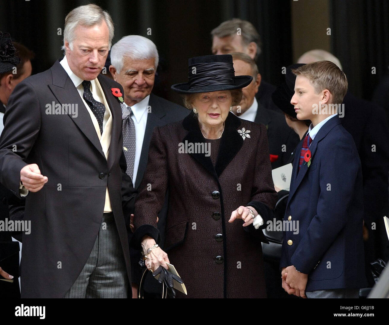 Former Prime Minister Lady Thatcher is comforted by her grandson Michael Thatcher and her son Mark outside the memorial service of her late husband, Sir Denis Thatcher, in The Guards Chapel, Birdcage Walk, London. Sir Denis died in June, aged 88 having undergone major heart surgery some six months earlier, from which it was thought he had made a good recovery. Stock Photo
