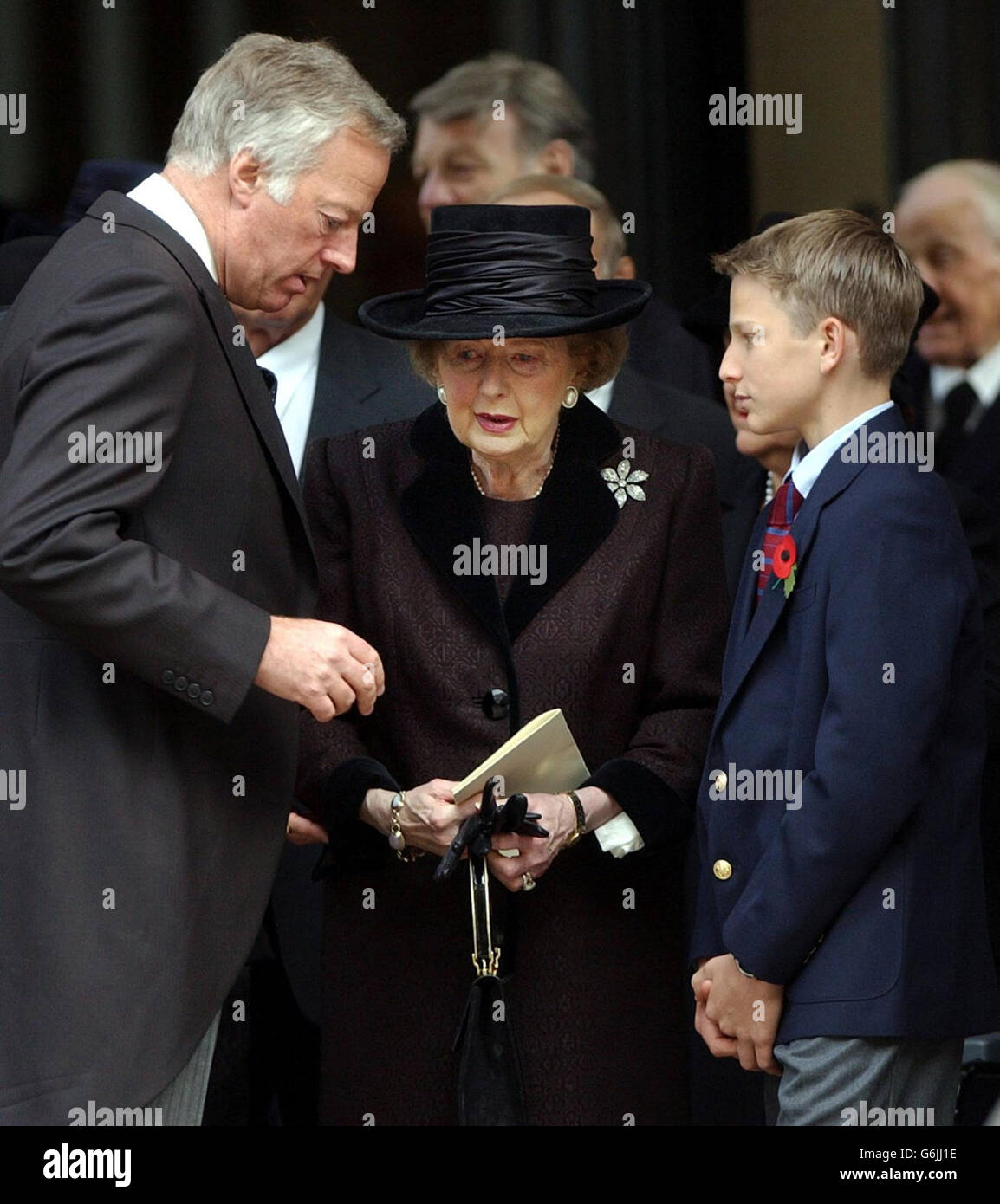 Former Prime Minister Lady Thatcher is comforted by her grandson Michael Thatcher and her son Mark outside the memorial service of her late husband, Sir Denis Thatcher, in The Guards Chapel, Birdcage Walk, London. Sir Denis died in June, aged 88 having undergone major heart surgery some six months earlier, from which it was thought he had made a good recovery. Stock Photo