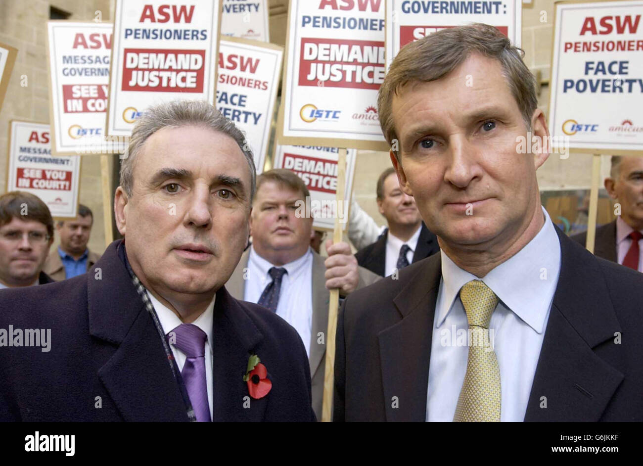 L-R: ISTC General Secretary Michael Leahy and Amicus Assistant General Secretary Paul Talbot outside Richmond House, Whitehall accompanied by former ASW workers, as they deliver a writ to the Department of Work and Pensions headquarters in London. The unprecedented action is being taken in support of 1,000 workers who lost their jobs earlier this year when steel firm ASW, which had factories in Cardiff and Sheerness, Kent, fell into receivership. Stock Photo