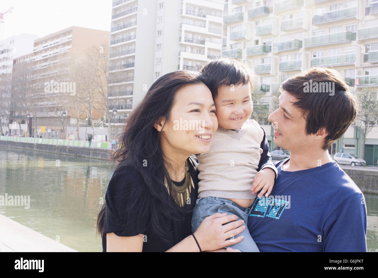 Parents and little boy in city Stock Photo